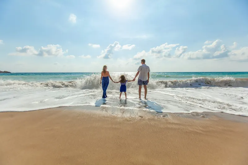 Family walking on a beach