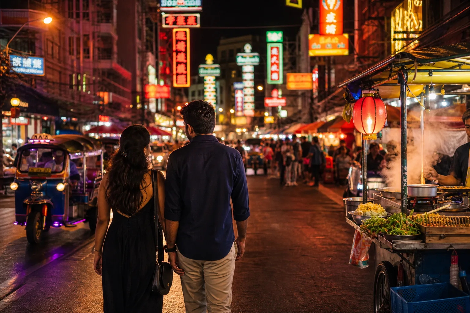 Indian couple exploring Bangkok Chinatown and its street-food stalls at night